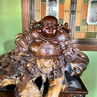 a statue of a laughing buddha