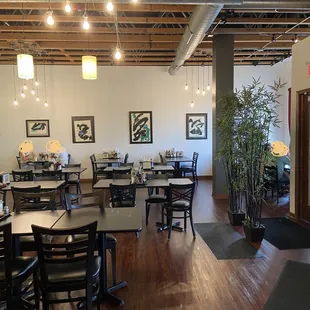 a restaurant with tables and chairs