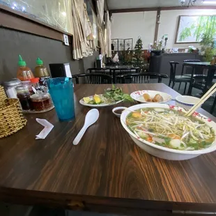 Medium #14 (seafood with bbq pork &amp; chicken and rice noodle) with fried egg roll and fish sauce.