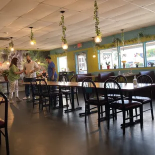 a restaurant with tables and chairs