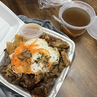The house special bowl with vermicelli and a side of pho broth, beef broth. Everything was so good and tender look how huge this plate is.