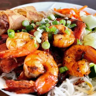 a plate of shrimp and noodles