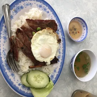 Pork chop with egg over rice