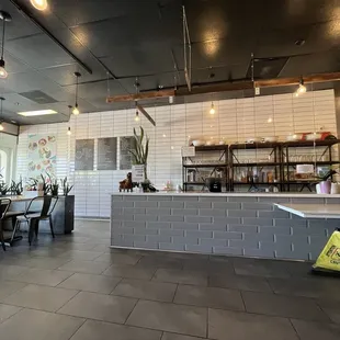 a view of a dining area with tables and chairs