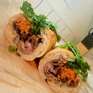 $10 Banh Mi Grilled Pork. Served on a baguette in tack, which I cut in half at home (11/4/21)