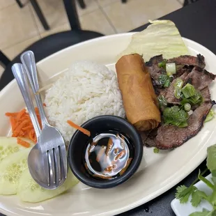 a plate of food with rice and vegetables
