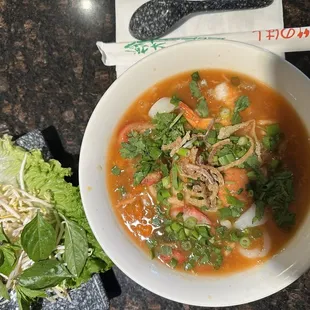 Rice noodle soup with shrimp ball, squid, lean pork bbq. Broth cook with Crab, pork bone &amp; shrimp.