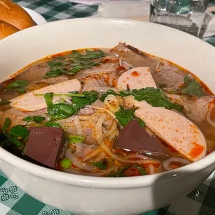 a bowl of soup with meat and vegetables