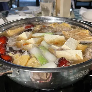 a pot of soup on a stove