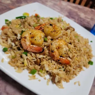 a plate of shrimp fried rice