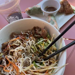 Shrimp spring rolls and vermicelli with pork and egg roll.