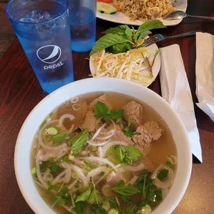 Pho with brisket and tendon, beef fried rice (back)