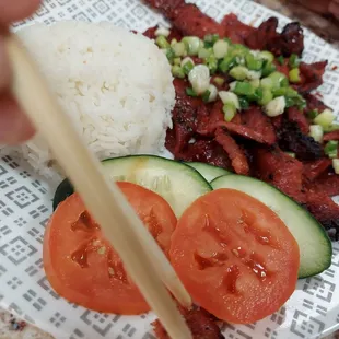 a plate of food with rice and vegetables