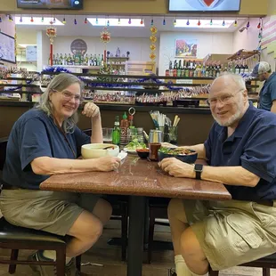 Table service: quality bowls, and metal utensils at a clean and comfortable table.