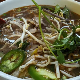 Special combo rice noodle with thin slices of medium rare steak