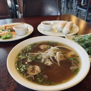 Round steak pho, eggrolls and shrimp spring rolls.