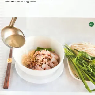 a bowl of noodles and shrimp