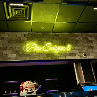 the neon sign above the bar