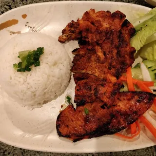 55. Com Ga Nuong Cha Gio Plate Grilled chicken and egg rolls with steamed rice.