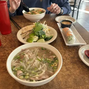 13P. Rare Steak, Well-Done Brisket and Tendon Noodle Soup 5B. Vegetables and Tofu Rice Noodle Bowl 01A. Spring Rolls(2 rolls)