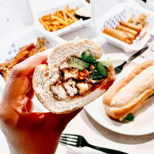 Tofu Banh Mi, tofu appetizer in back, fries &amp; veggie egg rolls