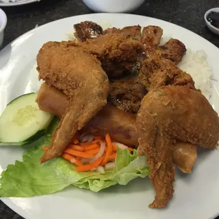 43. GriIIed Pork Chop, Fried Chicken Wings and Egg Rolls over Rice Combo Plate