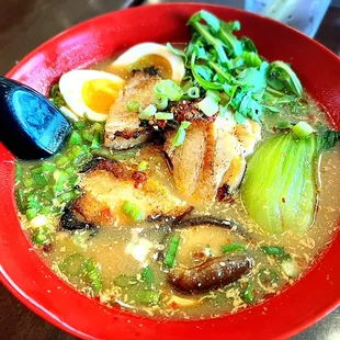 a bowl of soup with a spoon