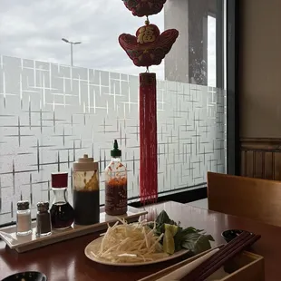 a plate of noodles and chopsticks