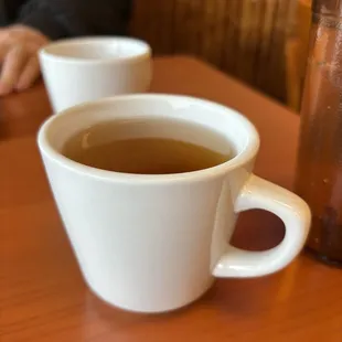 two cups of tea on a table