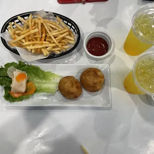 Cajun fries, passionfruit, drink, fried banh bao