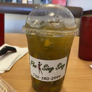 Passion fruit tea, with cut fruits and basil seeds