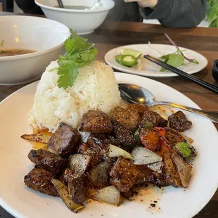 a man eating a meal at a restaurant