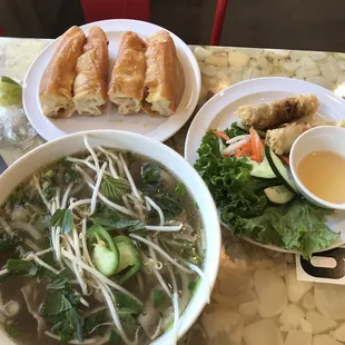 Pho Tai (rare steak) with a side of Chinese donuts! I can't believe they had the donut! You dip it in the broth, which is common in Vietnam!