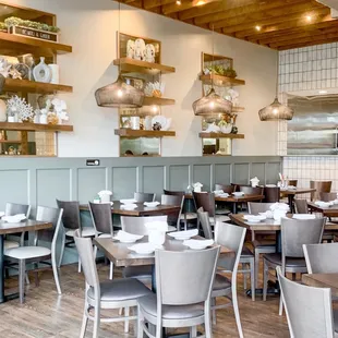 a dining room with tables and chairs