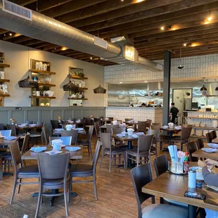 a dining area with tables and chairs