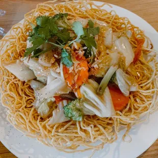 a plate of noodles and vegetables