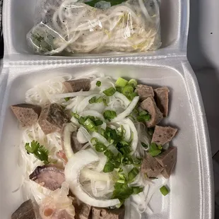 Pho meatball and I took my fiancés tendon from his combination lol