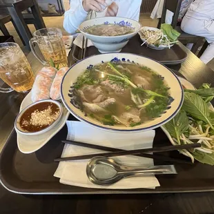 Signature pho, spring rolls and jasmine tea