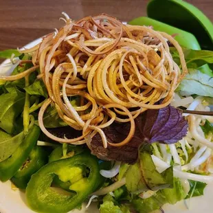 a plate of noodles and vegetables