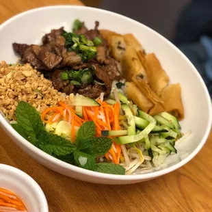 Grilled pork vermicelli with spring rolls