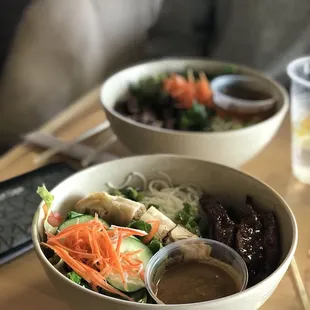 two bowls of food on a table