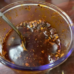 a bowl of sauce with a spoon