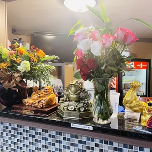 a vase of flowers on a counter