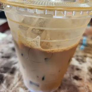 a plastic cup of iced coffee