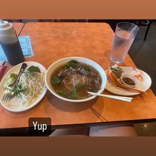 Steak Pho Tai (Steak) and spring rolls