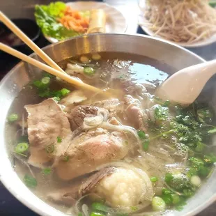 Pho with thinly sliced rare beef (cooks in the broth), lean brisket, and fatty brisket (phở tái, nạm, gầu)