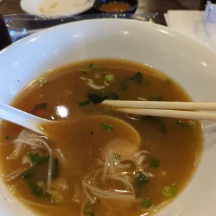 Fatty brisket pho with an empty plate that had my spring roll on it. Lol