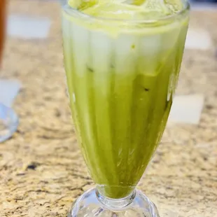 a green smoothie in a glass