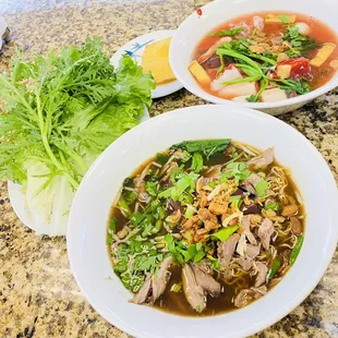 two bowls of soup on a table