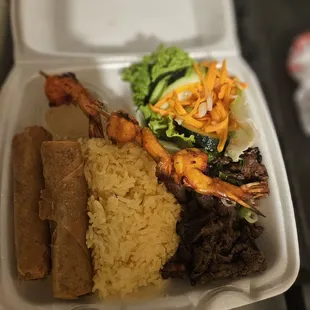Buttered rice plate with grilled beef, shrimp &amp; egg rolls